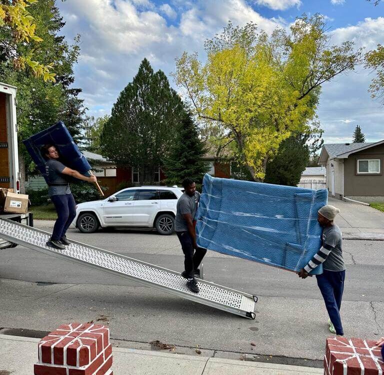 Last-minute movers in Etobicoke loading furniture for an urgent move